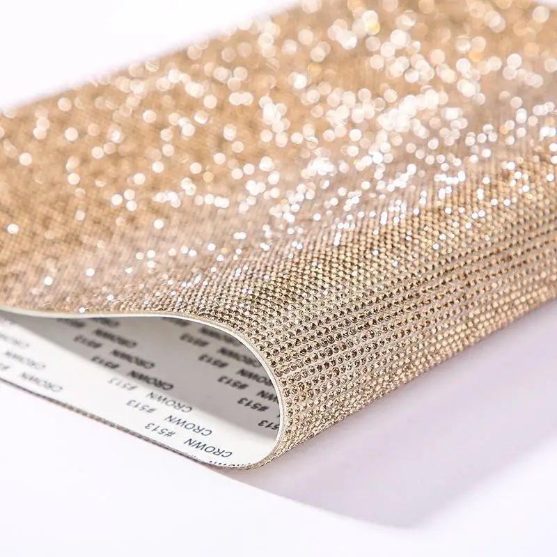 Close-up of sparkling gold rhinestone adhesive tape for DIY crafts and decor