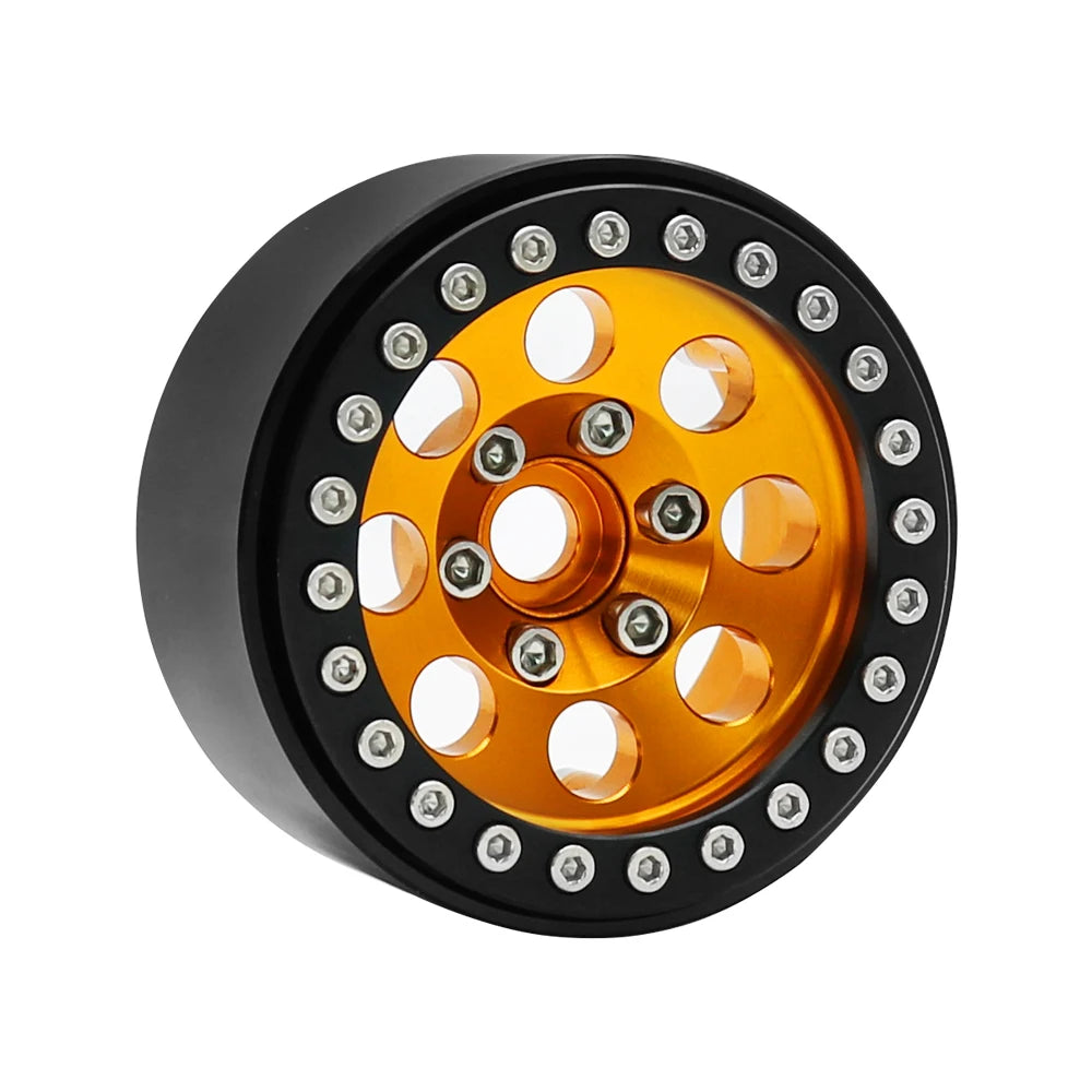Black beadlock wheels with a gold center and removable hex hub for an RC crawler.