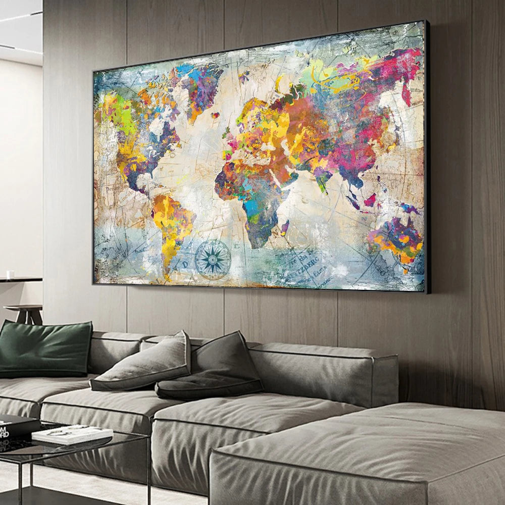 A vibrant abstract world map painting displayed on a wall above a modern gray sofa.