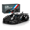 A detailed black 1:14 scale RC supercar building kit with a box and assembled model displayed on a white surface.