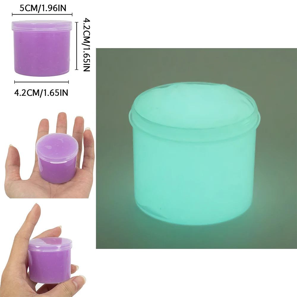 A clear plastic container of glow-in-the-dark crystal slime in a bright cyan color, shown next to a hand for scale.