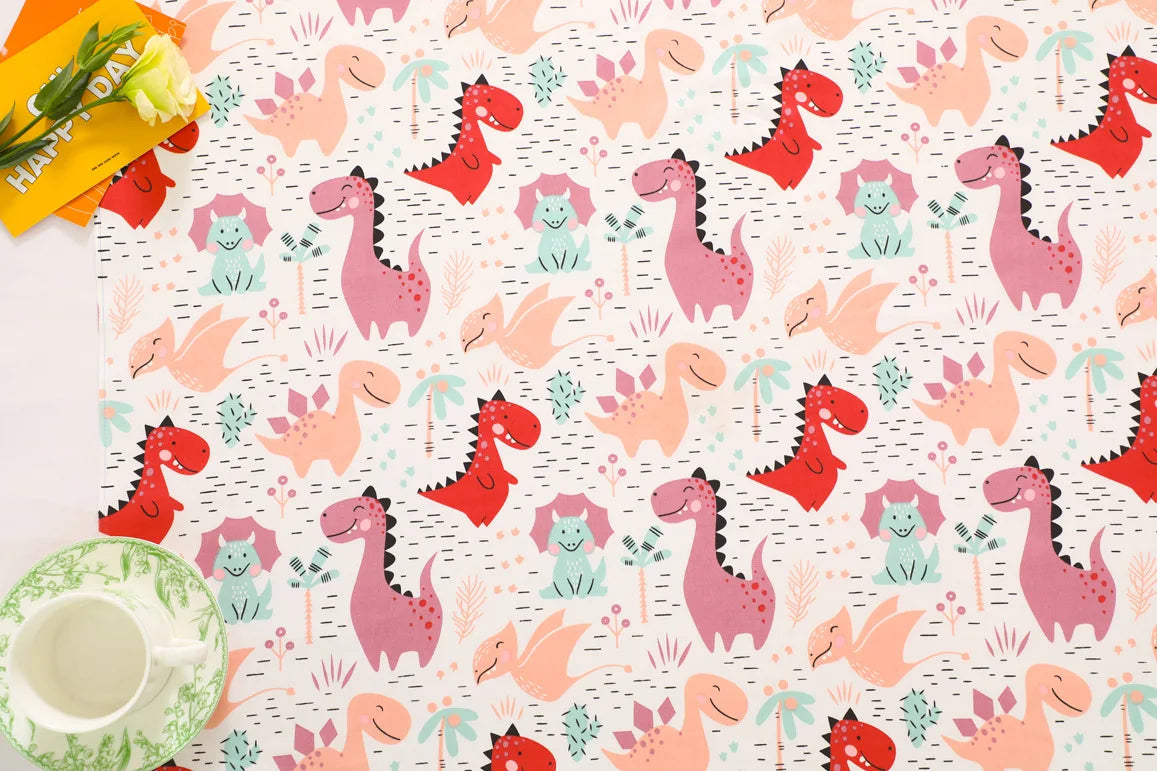 A fabric print featuring a grid pattern of pink and red dinosaurs on a white background.