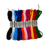 A collection of multicolor embroidery floss skeins in various shades including black, white, blue, red, orange, yellow, and g