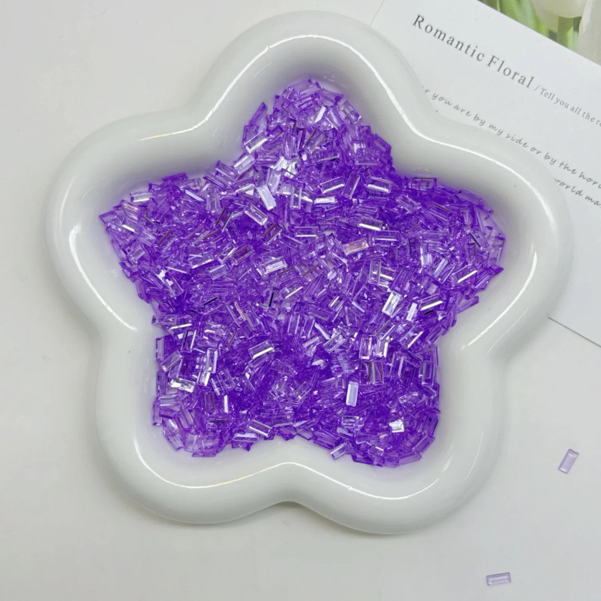 Purple iridescent acrylic ice strips filler for nail art and DIY crafts in a white mold