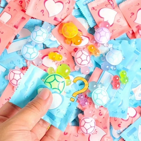 A hand is holding and examining a pile of glow in the dark mini turtle collectible figurines blind bags.