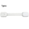 A white adhesive baby safety lock for cabinets and drawers.