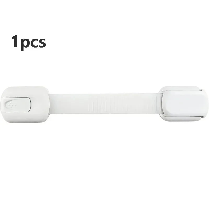 A white adhesive baby safety lock for cabinets and drawers.