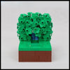 A LEGO building block model of Homer in the bushes scene featuring green foliage and a brown base.