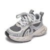 A pair of light gray breathable mesh kids running sneakers with a cushioned sole.