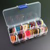A clear plastic storage box filled with a variety pack of colorful celluloid guitar picks.