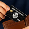 A hand holds a black card with gold accents and text reading Mexican Express on a brown leather wallet.