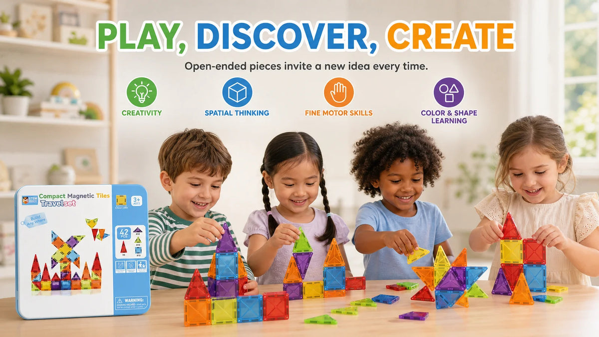 A child plays with colorful magnetic tiles on a wooden table, surrounded by various building structures.