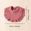 A pink cotton ruffle baby bib is shown flat with dimensions of 20 cm by 25 cm.
