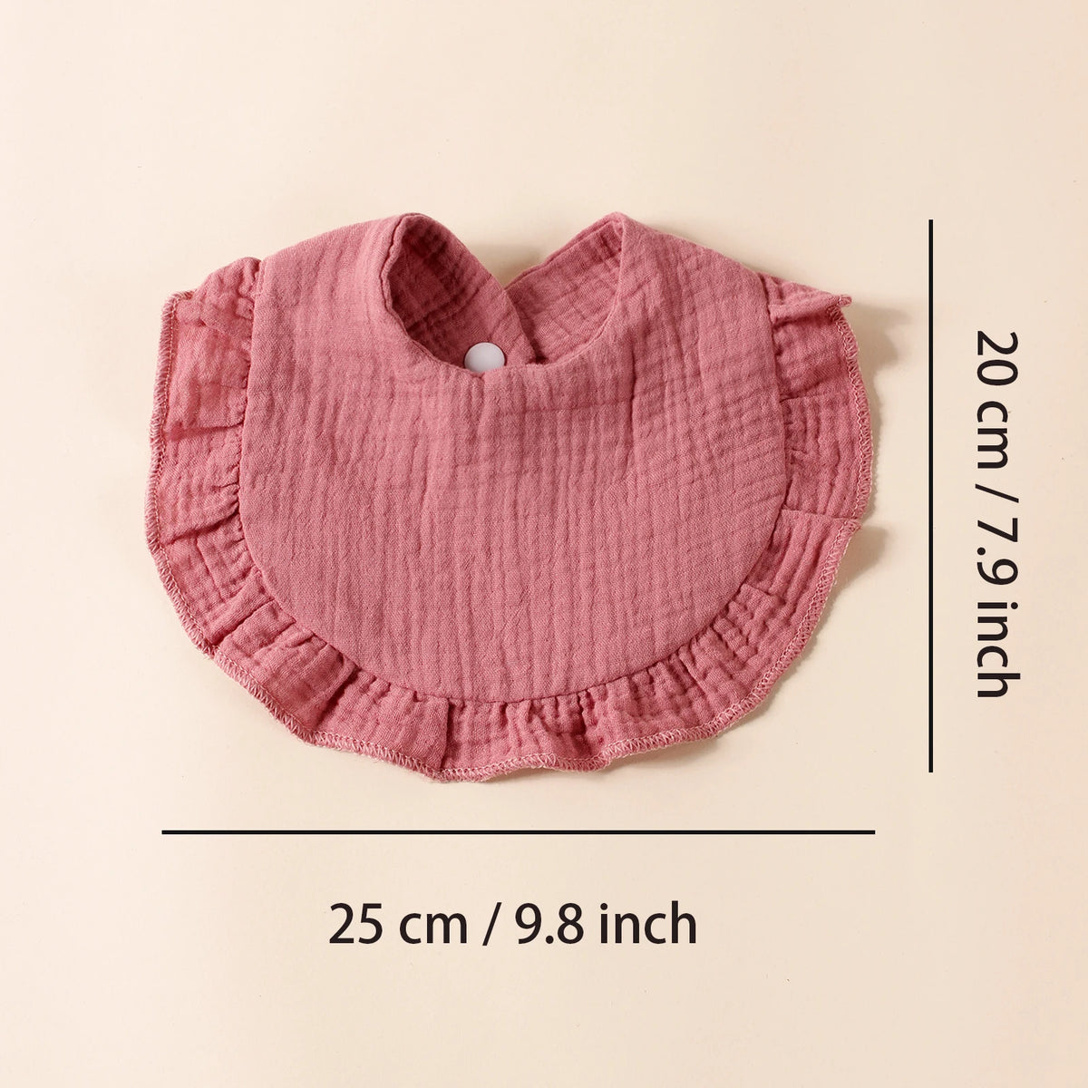 A pink cotton ruffle baby bib is shown flat with dimensions of 20 cm by 25 cm.