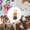 A collection of natural wooden spacer beads used for jewelry making and crafts, shown in various sizes and arrangements.