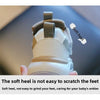 Close-up of a white and tan sneaker showing the soft heel feature on a child's shoe.