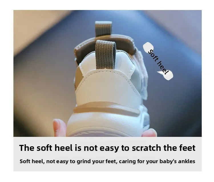 Close-up of a white and tan sneaker showing the soft heel feature on a child's shoe.