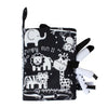 A black sensory cloth book featuring jungle animals like an elephant and lion for babies.