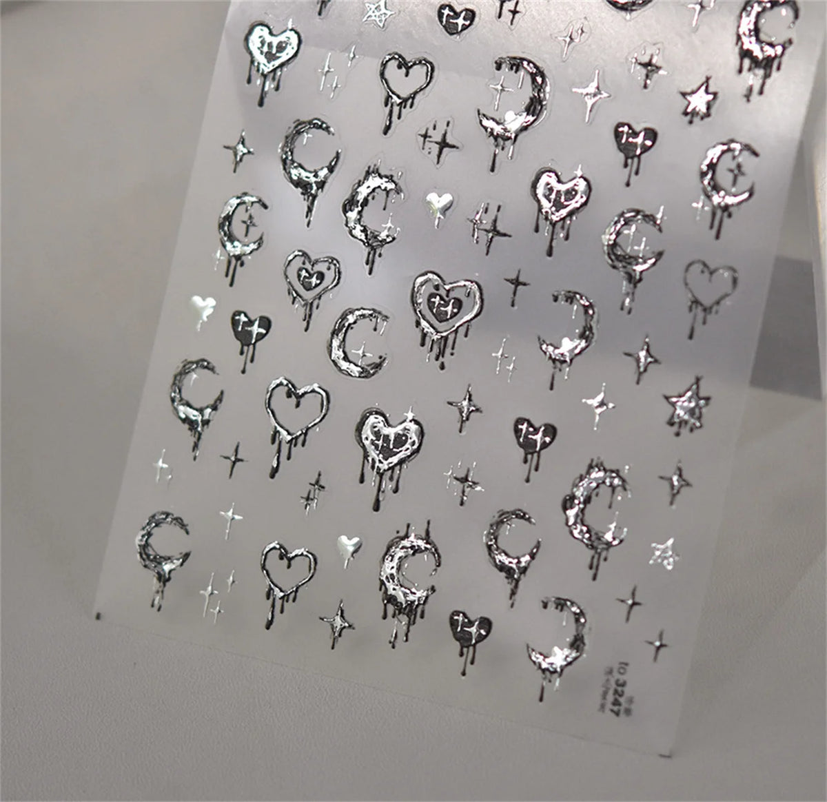 Clear stickers featuring various gothic symbols and shapes for nail art