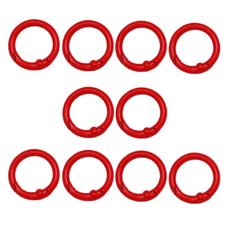 A set of six red alloy snap hook keychain clips arranged in a row.