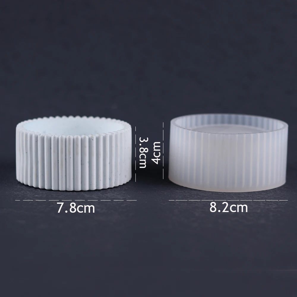 Two white silicone molds for concrete, plaster, and resin vases and planters shown side by side.