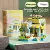 A green micro building block set featuring a flower shop scene with flowers and architecture.