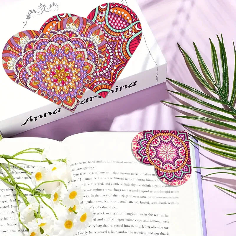 A set of six DIY mandala flower diamond art bookmarks featuring vibrant pink, orange, and purple patterns on a book.