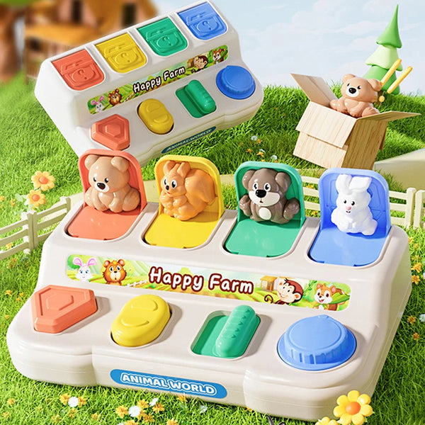 A white interactive pop-up animal toy set featuring various farm animals like bears and rabbits in colorful compartments.