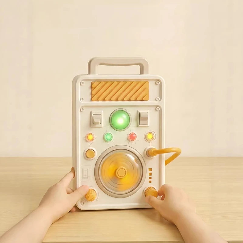 A hand is operating an interactive circuit busy board with lights and switches on a wooden table.