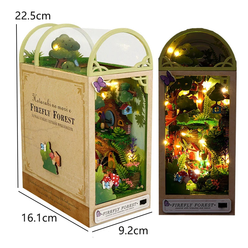 A wooden book nook kit featuring a miniature forest scene with trees and foliage.