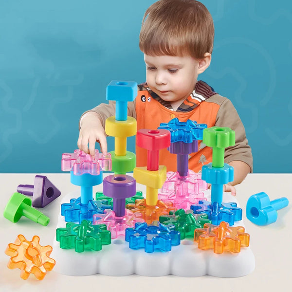 A young boy is interacting with a colorful peg board game featuring various plastic pegs and a white base.
