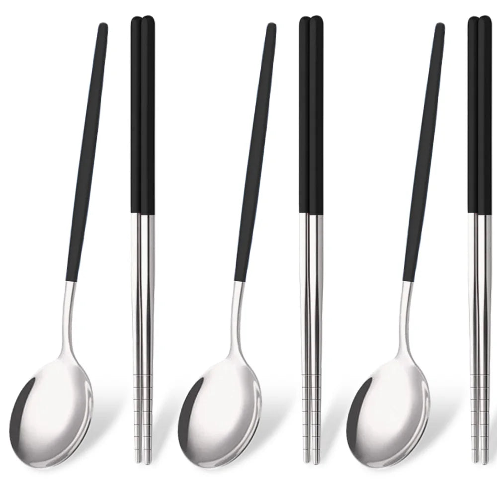 A set of six stainless steel Korean dinnerware pieces and chopsticks displayed vertically.