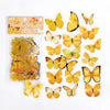A set of colorful butterfly stickers in various shades of yellow and orange for scrapbooking and journaling.