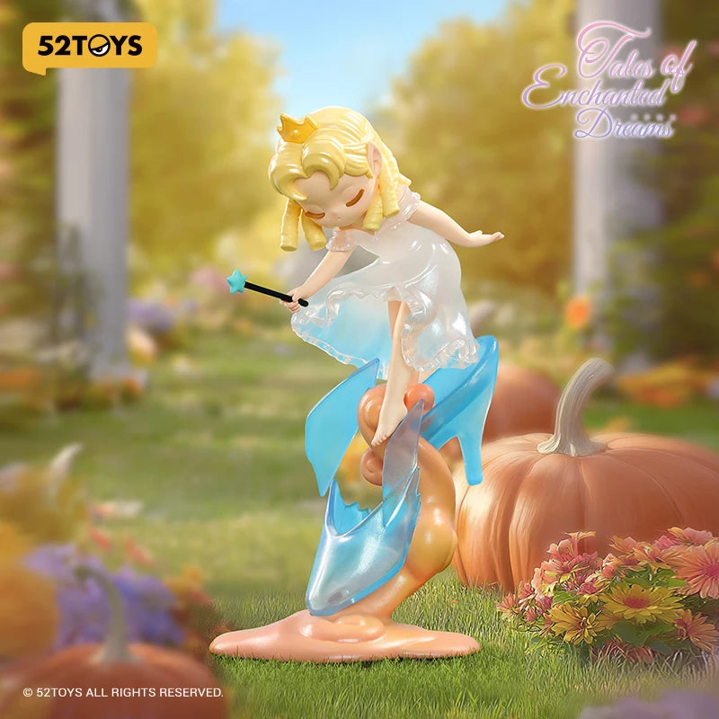 A blonde elf figure with a blue wand stands in a garden setting surrounded by pumpkins and flowers.