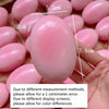 A pink squishy cheese cake stress relief toy is shown in a hand, with various size measurements visible.