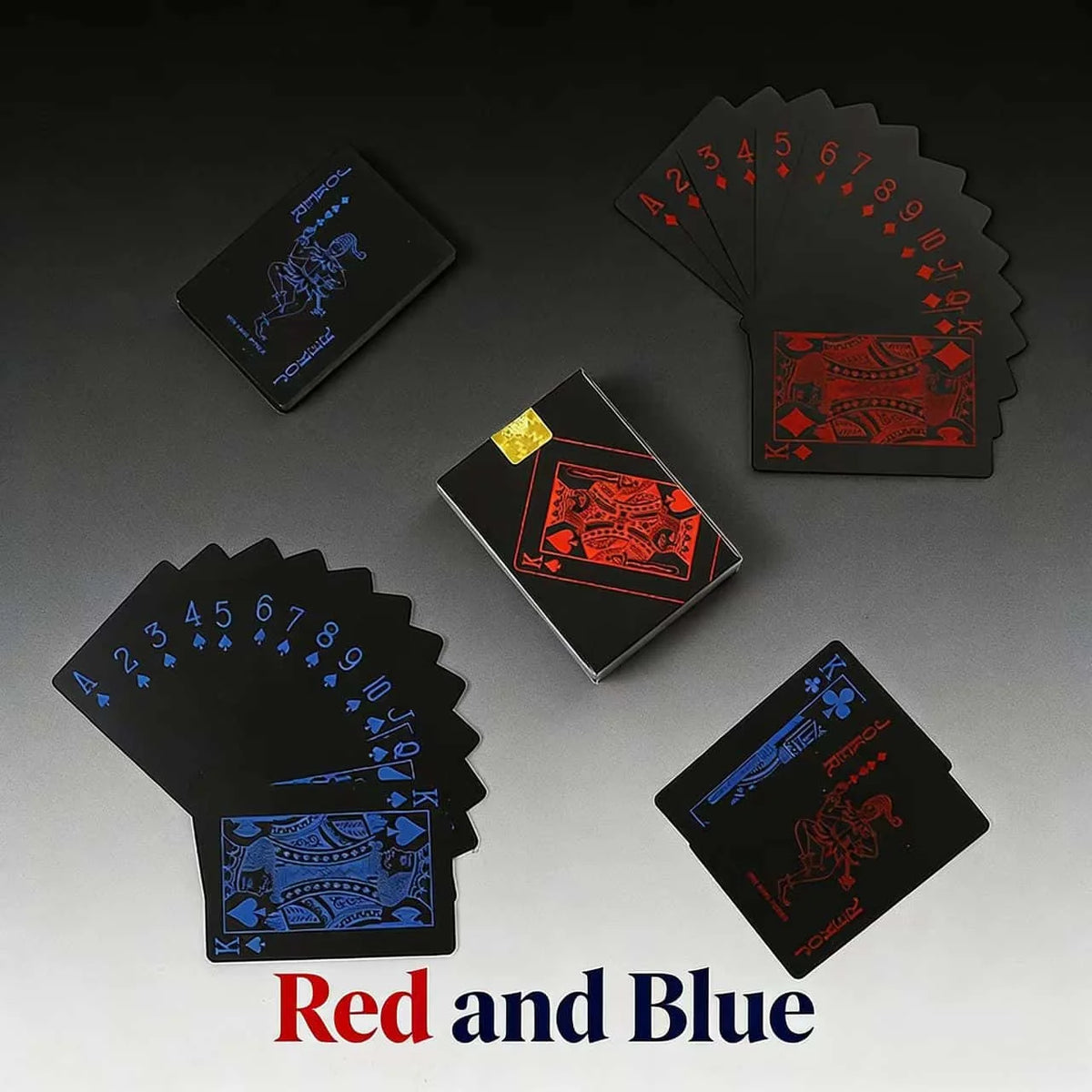 A collection of red and blue playing cards, including a deck and individual cards, displayed on a dark surface.