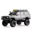 A silver 1:18 scale remote control off-road climbing car with a black roof rack and yellow lights.
