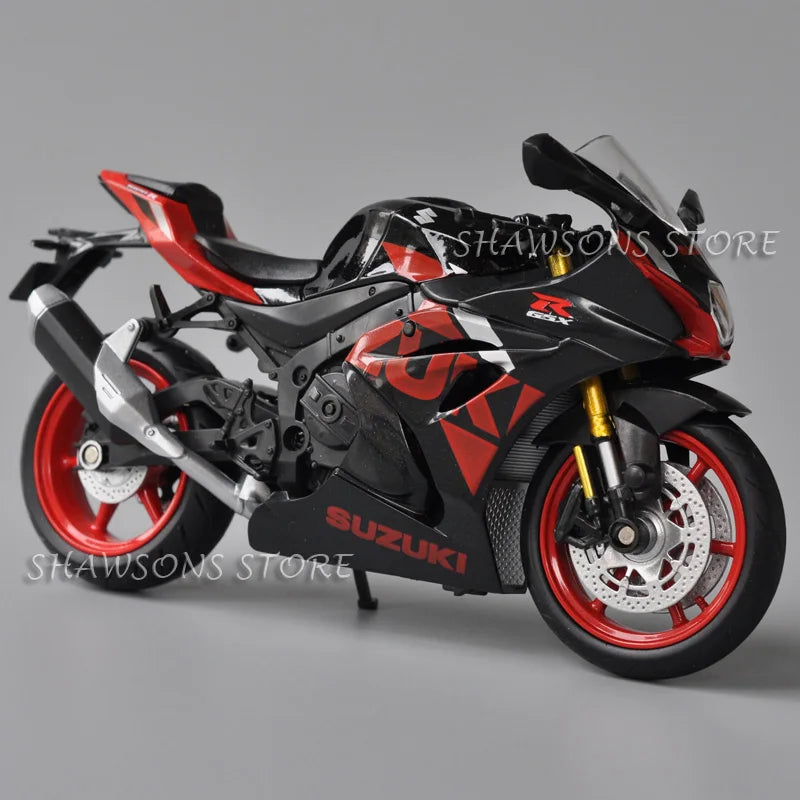 A black and red Suzuki GSX-R1000R diecast motorcycle model in a dynamic pose.