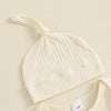 A cream ribbed baby boy long sleeve romper and matching hat displayed on a light background.