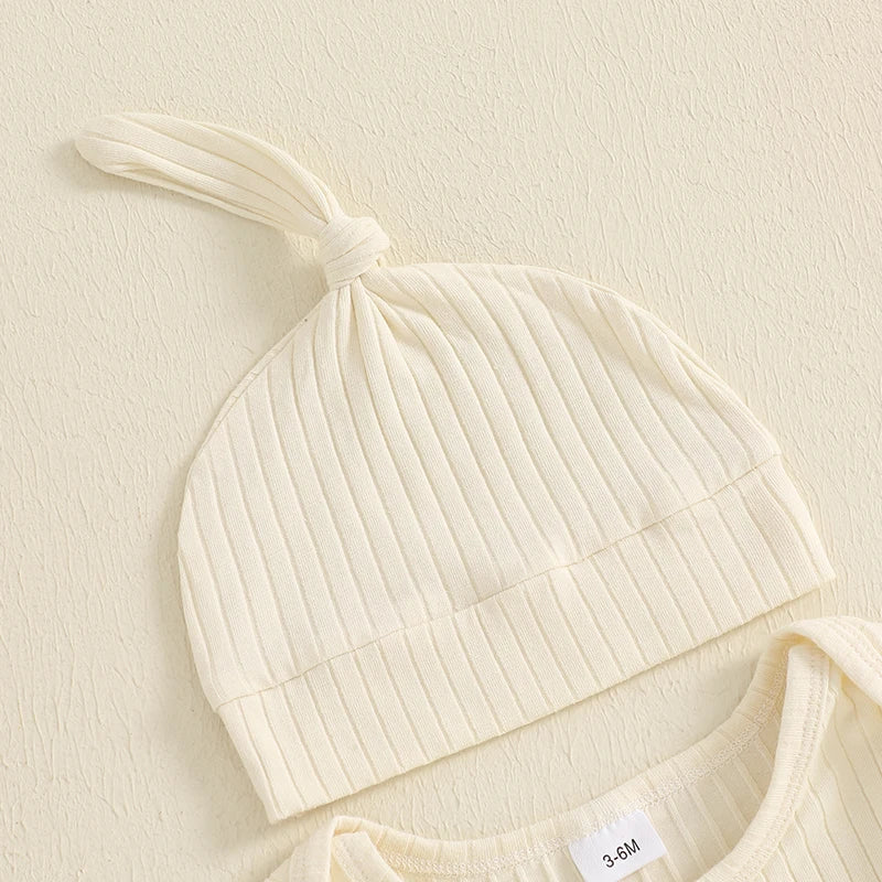 A cream ribbed baby boy long sleeve romper and matching hat displayed on a light background.