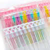 A collection of colorful mini bubble wands in various shades of pink, green, and yellow packaged for party favors.