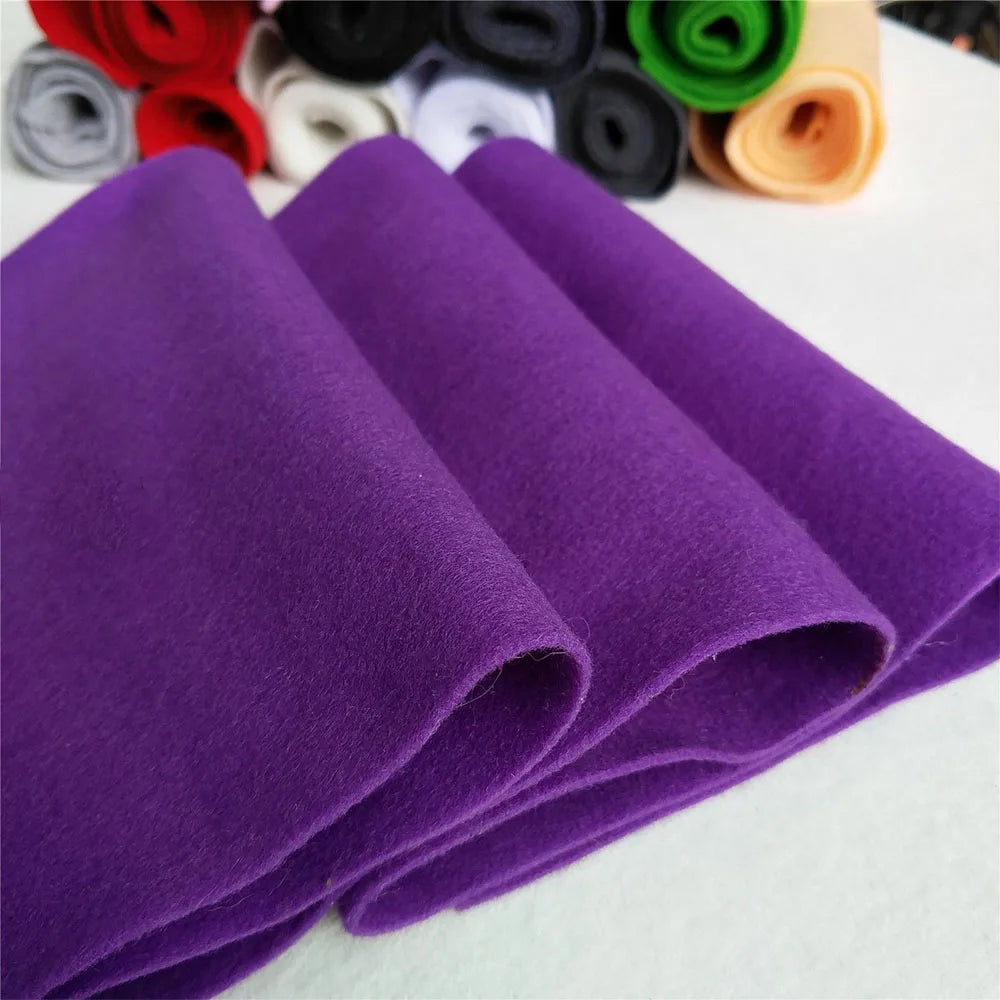 Purple felt fabric sheet rolled into several layers for DIY crafts and sewing projects
