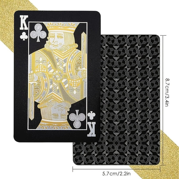 A set of luxury gold foil playing cards featuring a king design on a black card and a patterned black card.