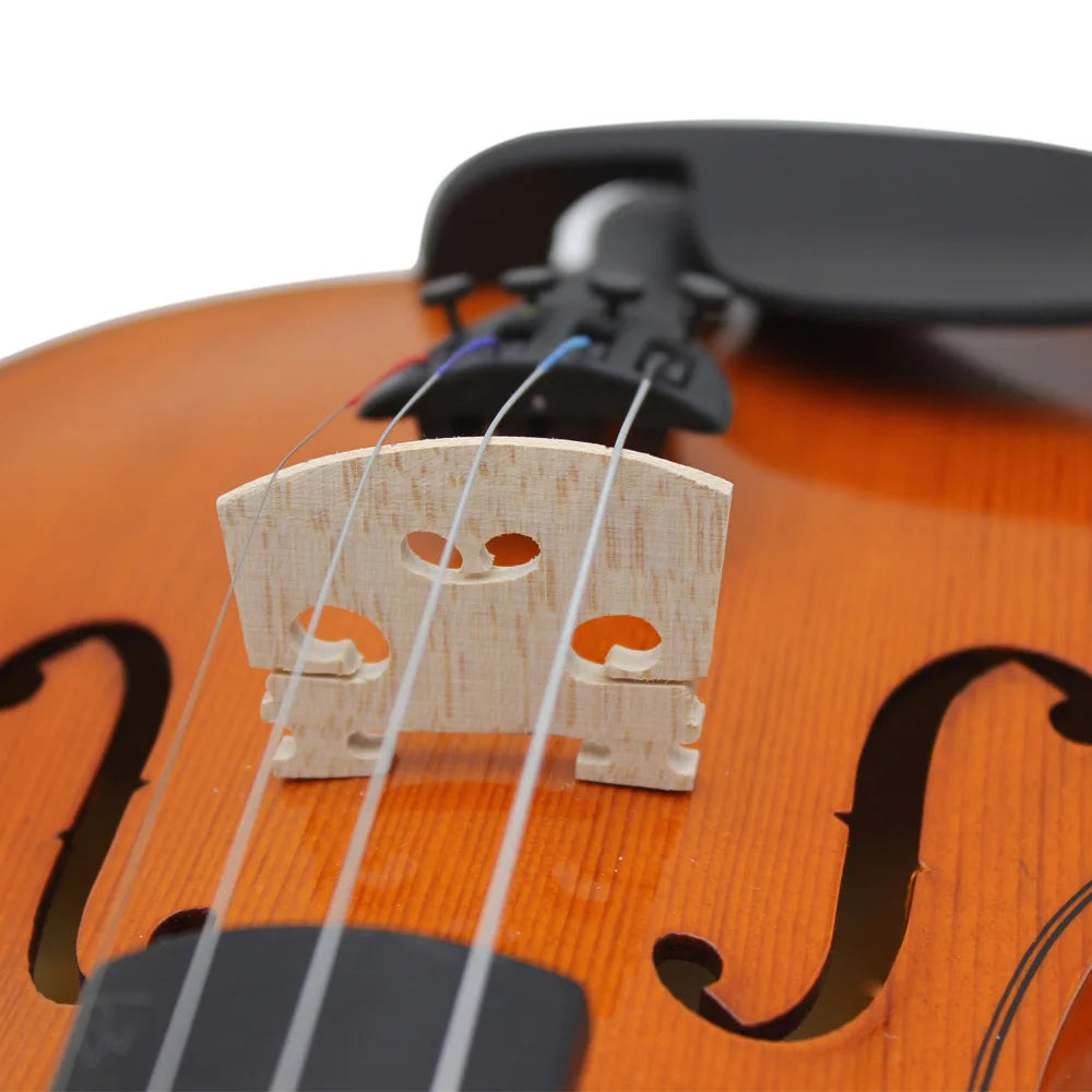 A close-up view of a maple wood violin bridge being installed on a wooden instrument.