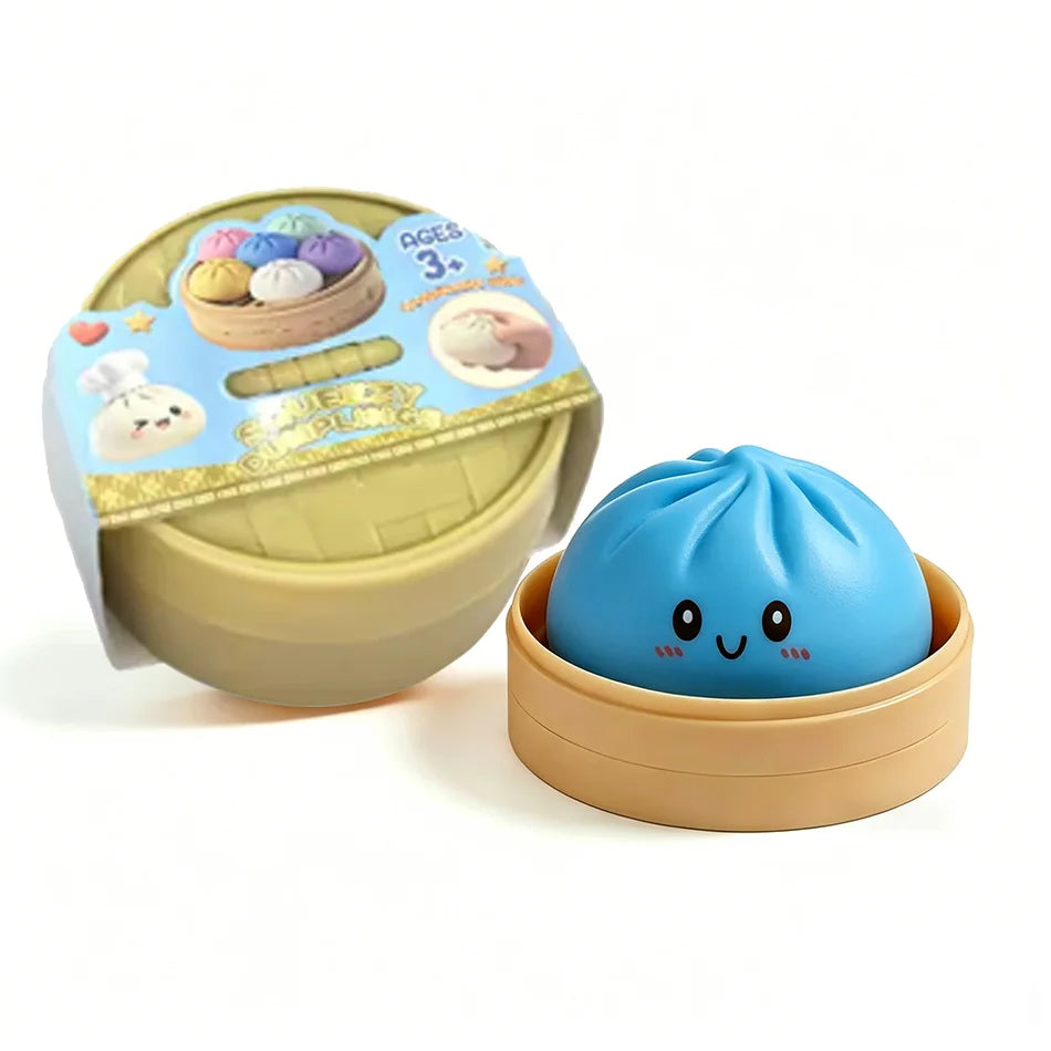 A light blue dumpling squishy stress ball is shown in its beige steamer basket container.
