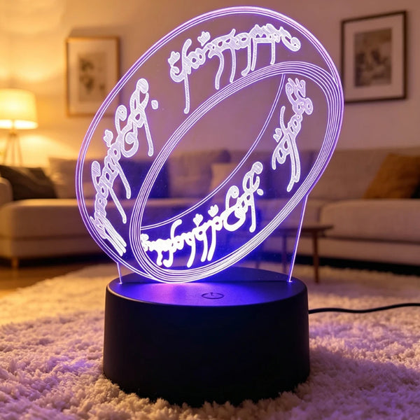 A glowing 3D LED night light shaped like a ring featuring Lord of the Rings characters on a dark base.