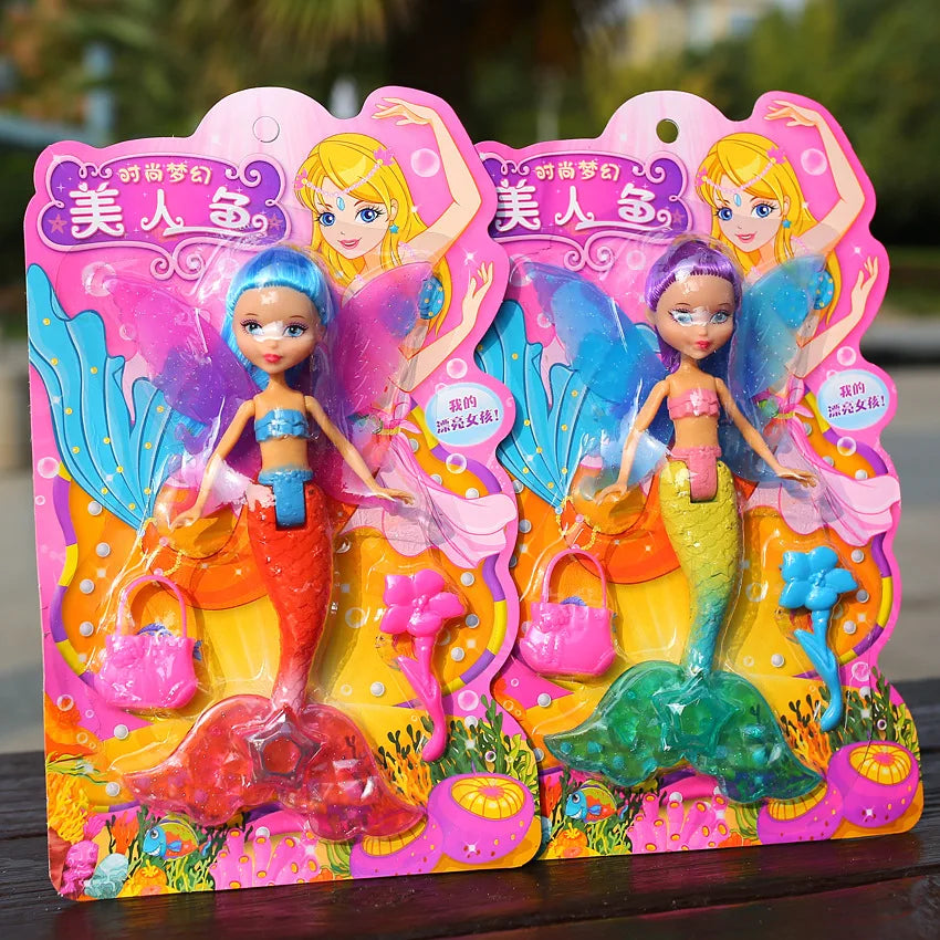 A colorful mermaid princess doll in pink and yellow packaging for imaginative play.