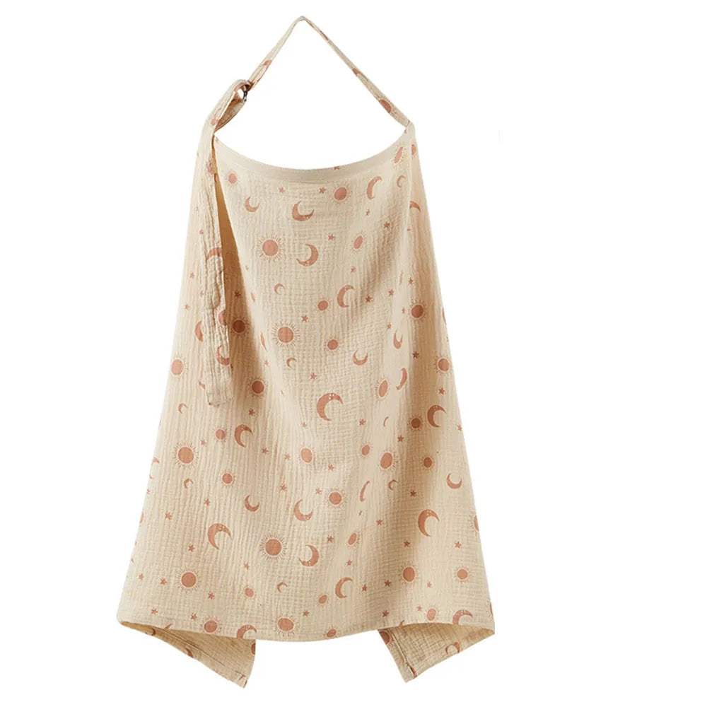 A beige breathable muslin nursing cover with a pattern of small pink crescent moons.