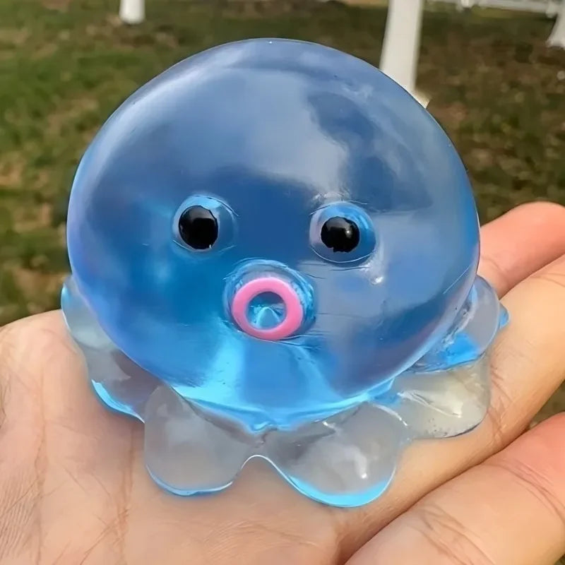 A translucent blue squishy ocean octopus fidget toy resting in a person's hand.