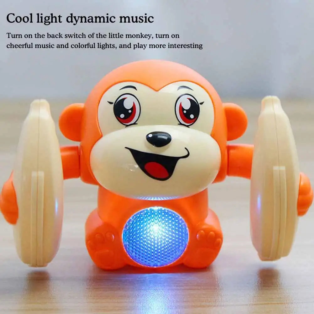 An orange monkey toy with a glowing blue light on its chest, designed to play music and colorful lights.